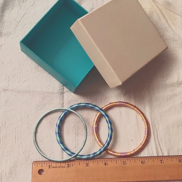 Jewelry - 3 yarn bracelets. 1 orange/lavender, 1 green/blue, 1 mint green.